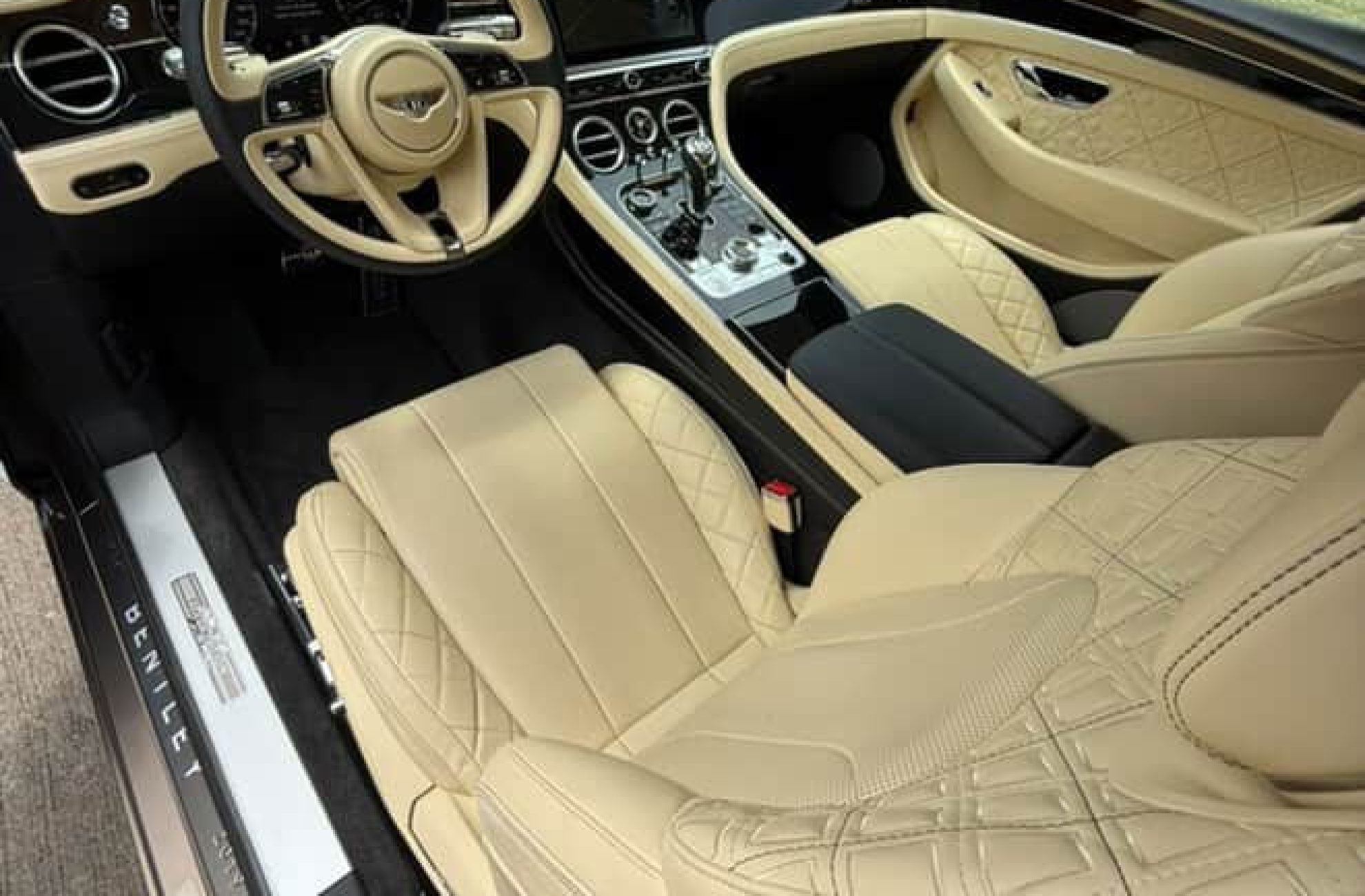 Plush beige leather interior of Bentley GT rental in Dallas